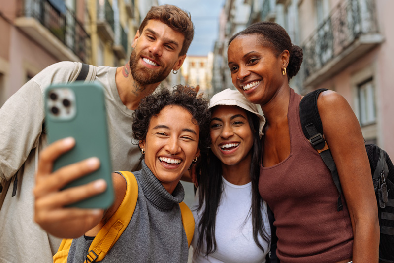 Image of a group of friends posing for a selfie.