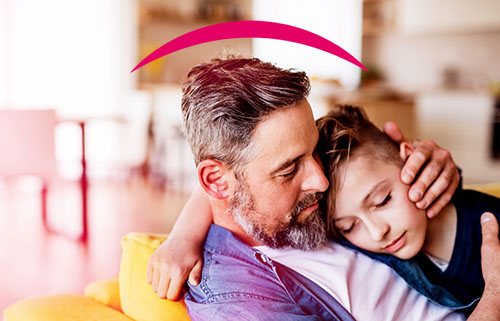 Woman looking into child's mouth.