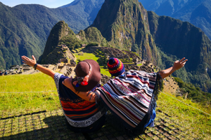 A couple of travellers admiring Machu Picchu