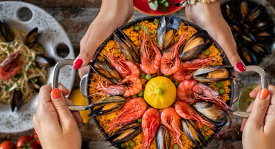 A large dish of seafood paella.
