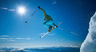 A skier in mid-air after jump.