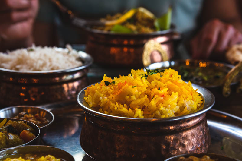 A close-up of a selection of asian dishes ready to be eaten.