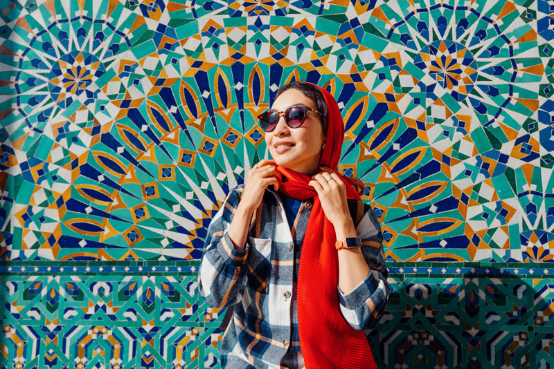 A young woman posing for  aphoto while exploring New York.